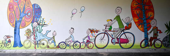 Nowy mural we Wrocławiu. Przedstawia uśmiechniętych mieszkańców na rowerach [ZDJĘCIA]
